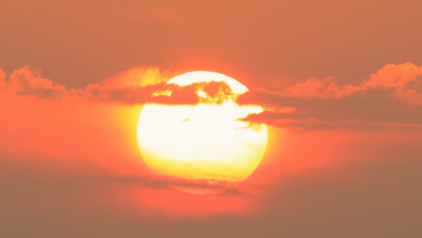 Huge sun going down at the sunset clouds passing by | Shutterstock HD Video #6395573