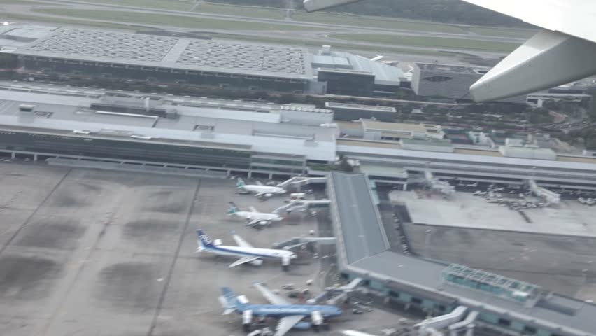 View from a jet taking off from Singapore Changi International Airport as seen from inside the aircraft .