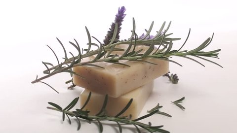 Seamless loop of organic herbal soap fresh lavender and rosemary isolated on white V3