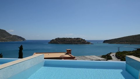 Swimming pool at luxury villa with view on Spinalonga island, Crete, Greece