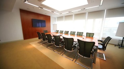 Turning off lights in stylish room for business meetings
