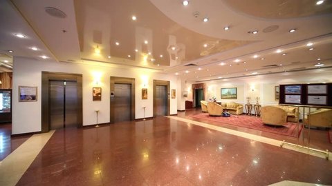 MOSCOW, RUSSIA - MAY 22, 2013: People in hall with doors to elevators in Bogorodino hotel. Four-star Borodino hotel located near Sokolniki Park and is modern building with elegant interiors.