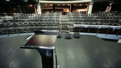 Document stand on stage and empty auditorium in business hall