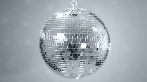 Mirror ball reflects white light. Disco ball with reflected moving rays. Loop.
