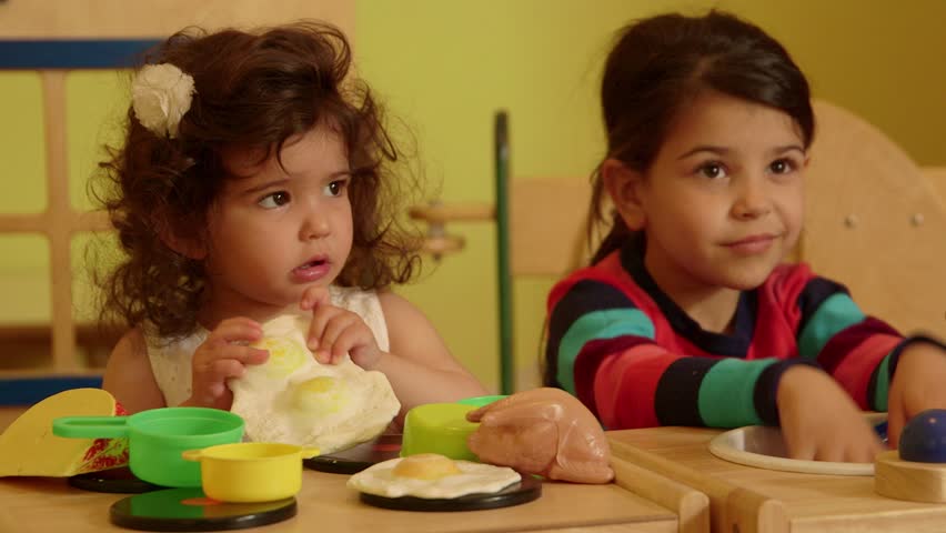 Little children, kids, baby, playing in kindergarten, school. Little girls, female friends playing with toys in preschool, child crying and screaming. Recreation and education. 4of15
