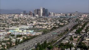 Los Angeles city freeway. This clip is an aerial shot of downtown Los Angeles, California and a major freeway running through it.