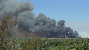 Speed Up of Fire and smoke behind homes. 4k Video - Poinsettia Fire - Carlsbad, CA May 14th 2014