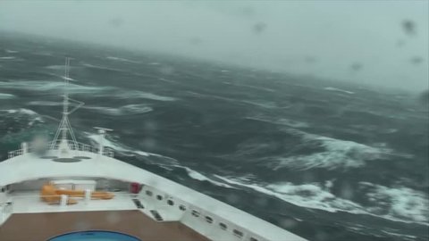 Wave crashes over bow of cruise ship during Force Ten Storm in the Mediterranean.
