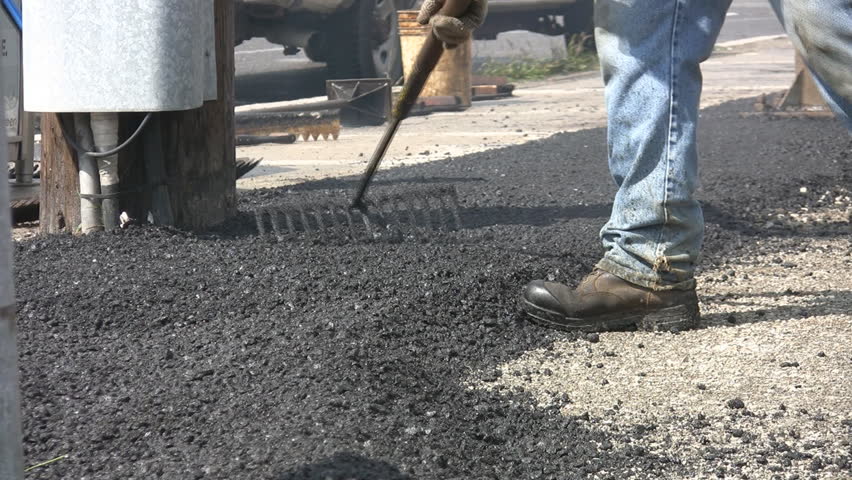 Raking Hot Asphalt. Man Rakes Stock Footage Video (100% Royalty-free ...