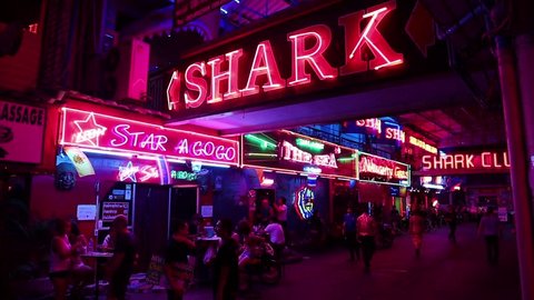 THAILAND, PATTAYA, MARCH 31, 2014: Walking Street is red-light district with many restaurants, go-go bars and brothels, that draws people, primarily for night life and sexual entertainments
