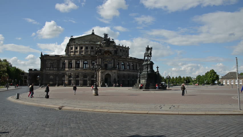 view to the Semperoper in Dresden. The place calls Theaterplatz. In the middle the Statue of king Johann