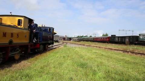 GOES, THE NETHERLANDS - MAY 31 2014: A splendid event for all ages: Railway to the past 2014. Vintage steam and diesel engines are coming by, offering you the possibility to make a beautiful journey. 