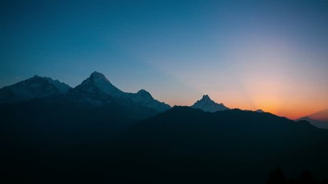 4k timelapse of sunrise at Himalaya mountains. Annapurna I, Annapurna South and Machapuchare mountain (Fishtail) within eyeshot. Poon hill, Ghorepani, Nepal. 