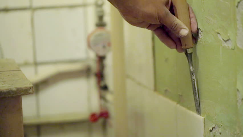 Man removing tile in bathroom | Shutterstock HD Video #6497660