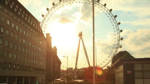 LONDON - MAY 15: London skyline with London Eye also named Millennium Wheel  on April 14, 2013 in London, UK. London Eye is the tallest Ferris wheel in Europe at 135 meters. establishing shot