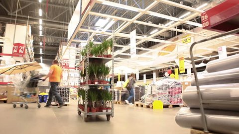 SAINT-PETERSBURG, RUSSIA-CIRCA MAY, 2014: Movement through the Ikea warehouse with shopping customers. Russian Ikea store and services