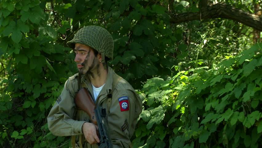 SIGNA – MAY 18: US airborne meet infantry troops at Sainte Marie-du-Mont during the reenactment of Normandy landings on 18 may 2014 in Signa, Italy