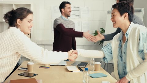Handshake at business meeting showing teamwork