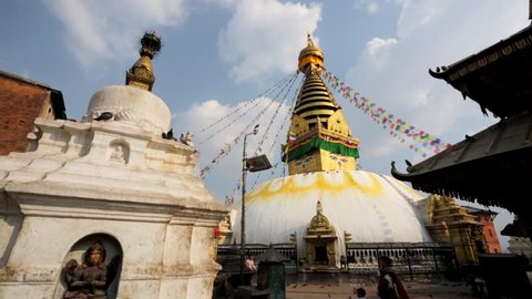 KATHMANDU, NEPAL - CIRCA MARCH 2014: People visit Swayambhunath or Monkey temple. The temple is protected as the UNESCO world heritage site.