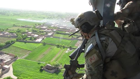 Afghanistan, Circa 2010: air force parajumper (pj) keeps eye on terrain in Afghanistan, Circa 2010