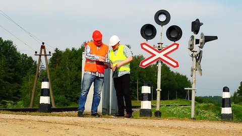 Railroad workers with folders near signal beacons episode 3
