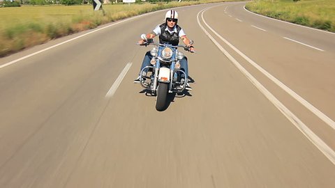 reggello,1/05/2014 motorbike festival,man riding his harley davidson on a highway follow shot car point of view