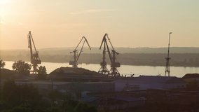 timelapse sunset in port with crane