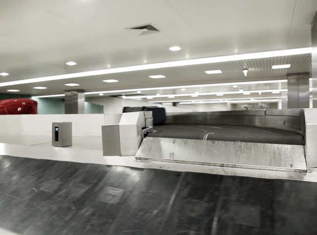 Airport baggage belt with moving luggage 