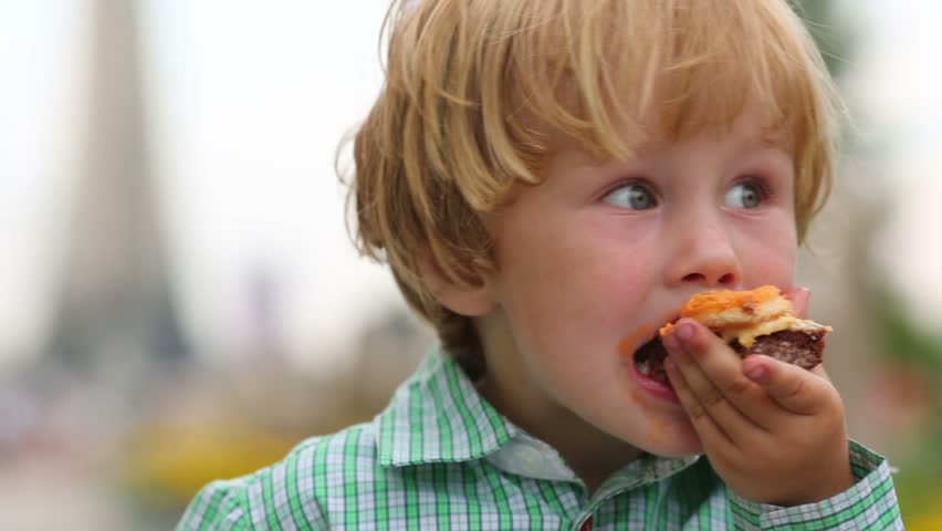 Webcams eating. Children eat fast food. Little Kid crying and eating Burger.