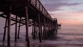 Time lapse video of The Balboa Pier in Newport Beach, California at sunset
