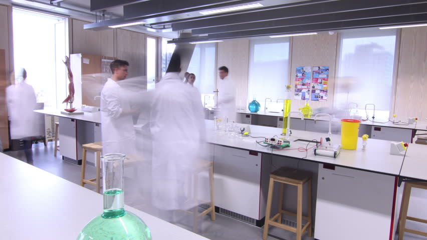 Time lapse group of students working in science class in modern university.