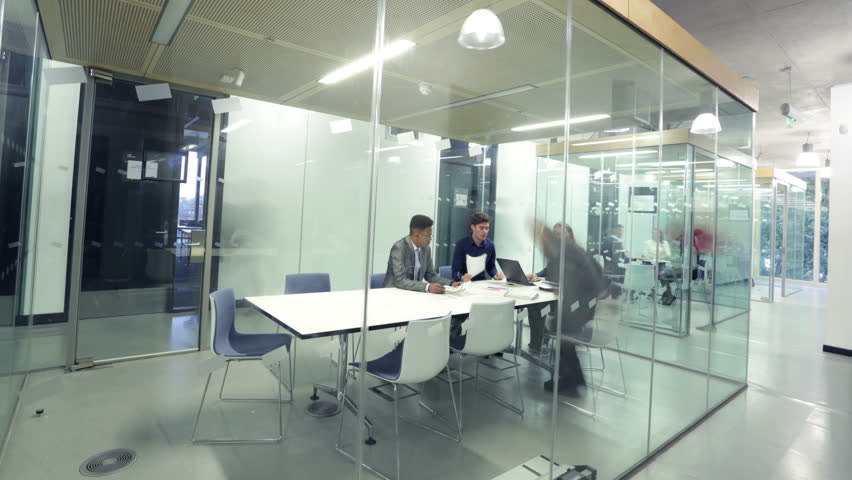 Time lapse of young attractive business group in a meeting in modern city office | Shutterstock HD Video #6548816