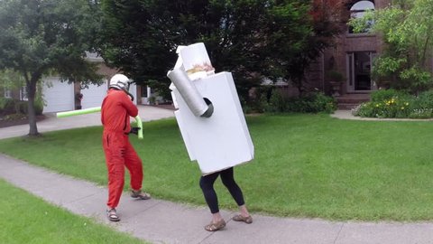 Astronaut fighting a robot. nonsense concept.