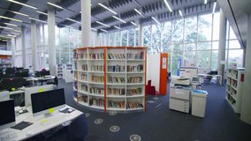 Interior view of the library in a large modern university building. No people - Powered by Shutterstock - Get 15% off with code: PIKWIZARD15