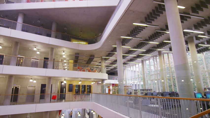Diverse group of students in large modern university building