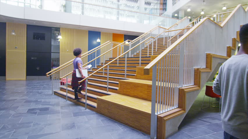 Diverse group of students in large modern university building