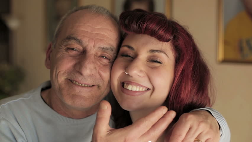 Senior man and young girl smiling together. video filmed in close-up | Shutterstock HD Video #6556373