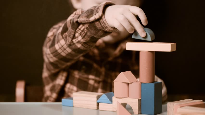 kid playing with wooden blocks Royalty-Free Stock Footage #6557453
