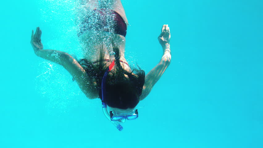 Brunette Swimming Underwater Wearing Snorkel Stock Footage