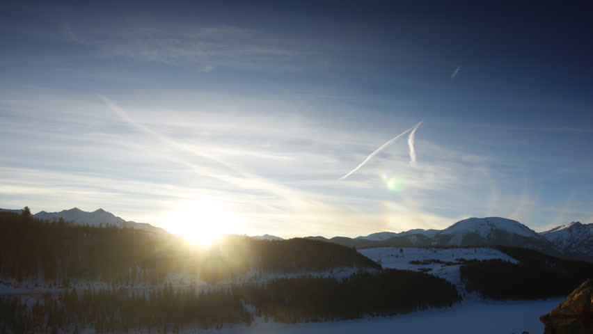 Beautiful sunset over a frozen lake in the Rocky Mountains of Colorado. 
