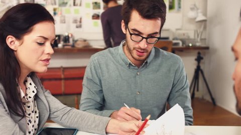 Creative business team presenting architectural plans hipster office discussing new ideas