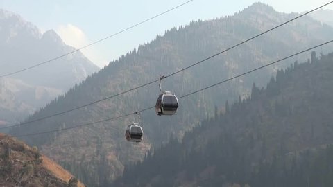 movement passenger gondola lift in Chimbulak Ski Resort, Kazakhstan near Almaty 