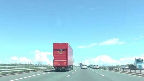 Royal mail van going past in car camera, m6 motorway in summer