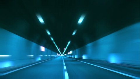 Driving through tunnel, abstract with motion blur and glow