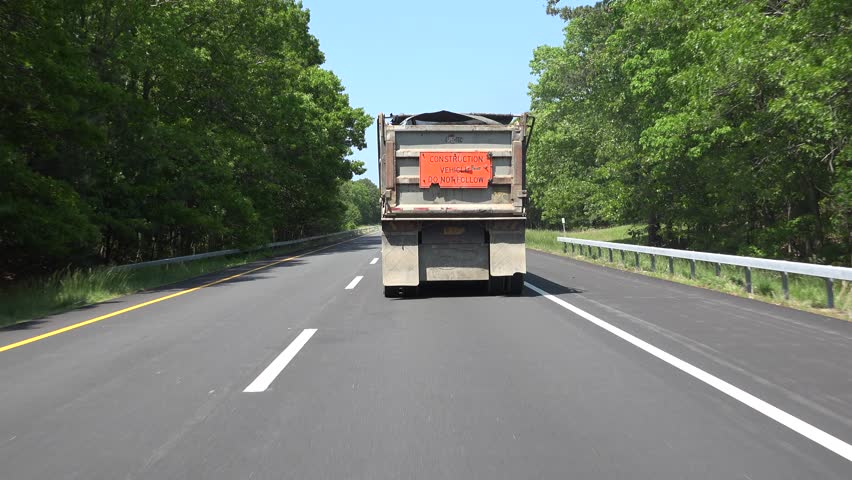 Driving Behind Dump Truck On Stock Footage Video (100% Royalty-free