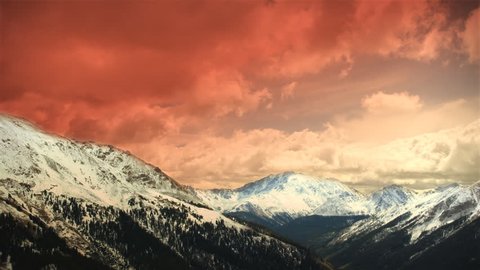(1151) Early Early Winter Mountains Snow Sunset Clouds Skiing. Great for themes of skiing, winter sports, adventure, mountains, nature, weather, tourism, travel. Excellent loop for nature composites. Stock Video