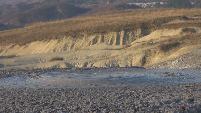 Spectacular, amazing view of bubble gas eruption of thermal sulfur, closeup of mud volcano in summer day