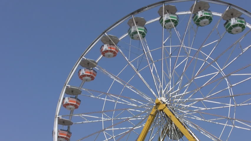 Ferris wheel.  Big ferris wheel with multi-coloured cars at big fair. Toronto, Ontario, Canada. 