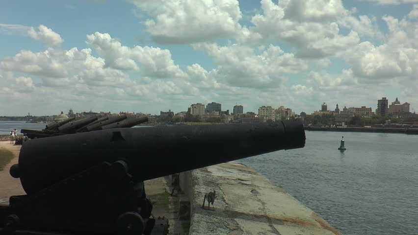old canons at fort of saint charles (Fortaleza de San Carlos de la Cabaña) in havana,cuba. Skyline of old city of havana in background
