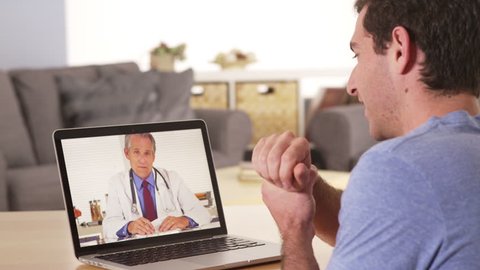 Patient using laptop to talk to doctor